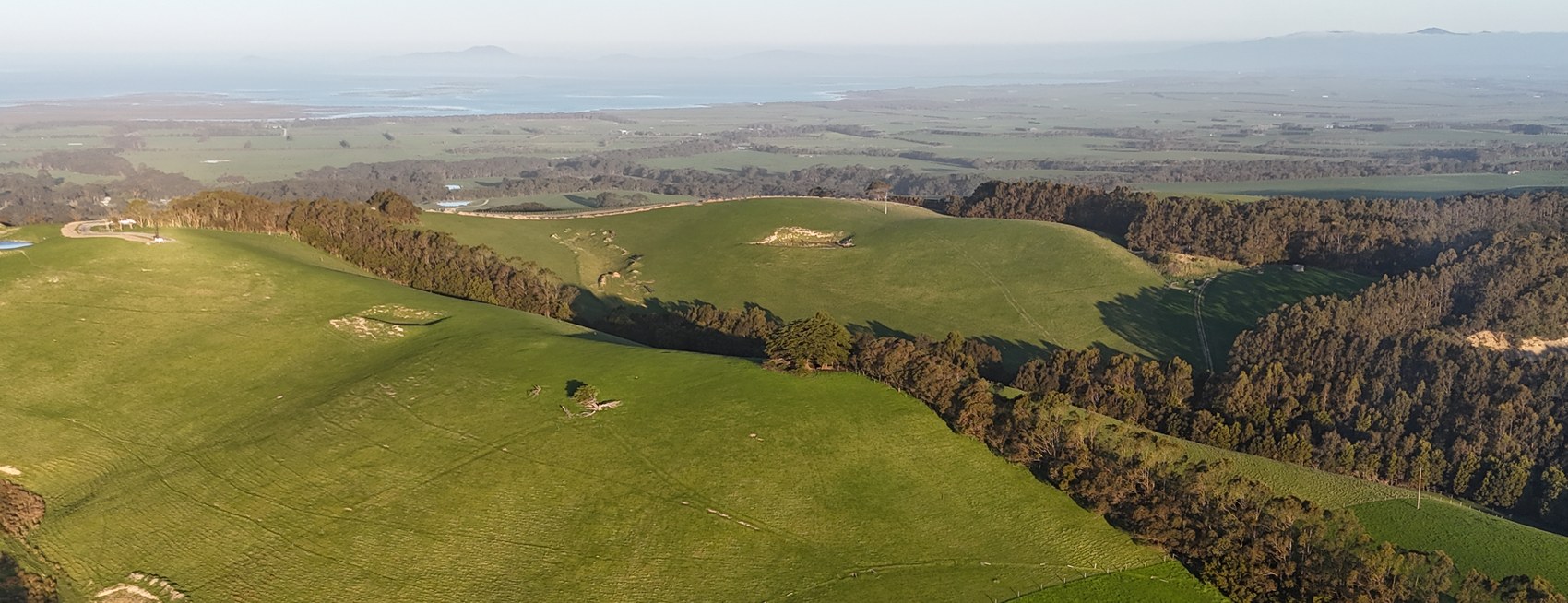 Drone photo looking south-east across the green Hoddle Range ridge to Corner Inlet and Wilsons Promontory, as it is today.